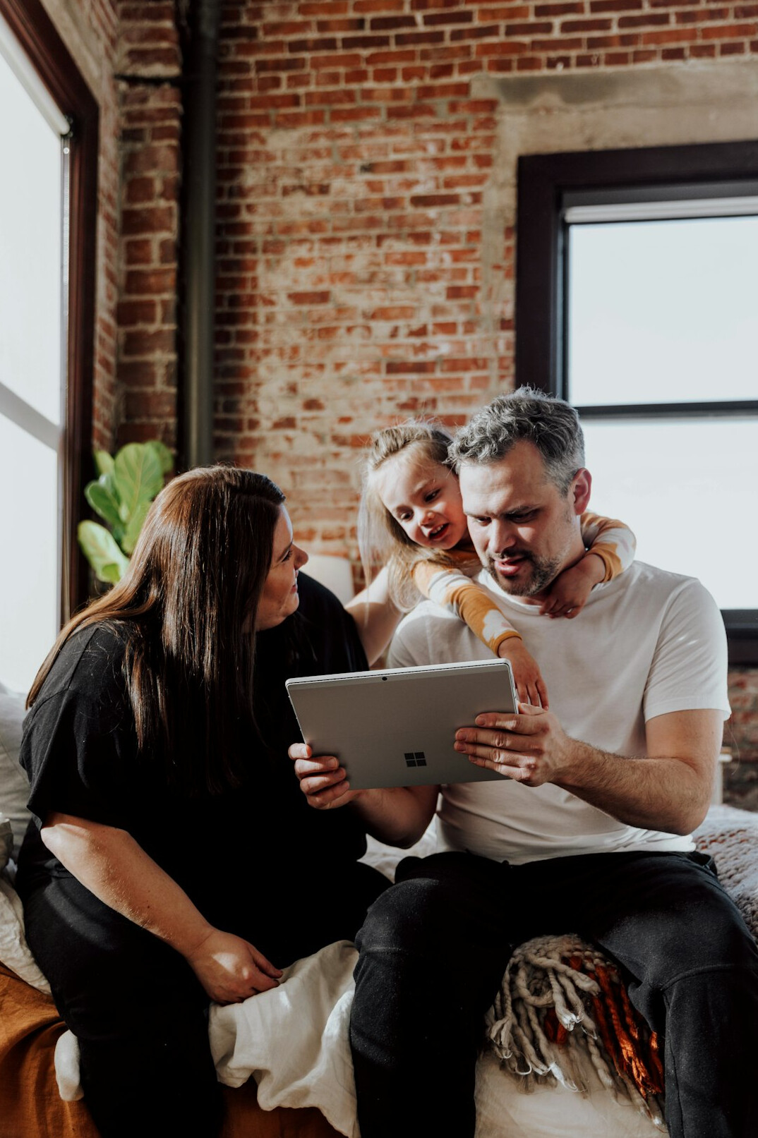 Team meeting around a table with laptops in a bright office