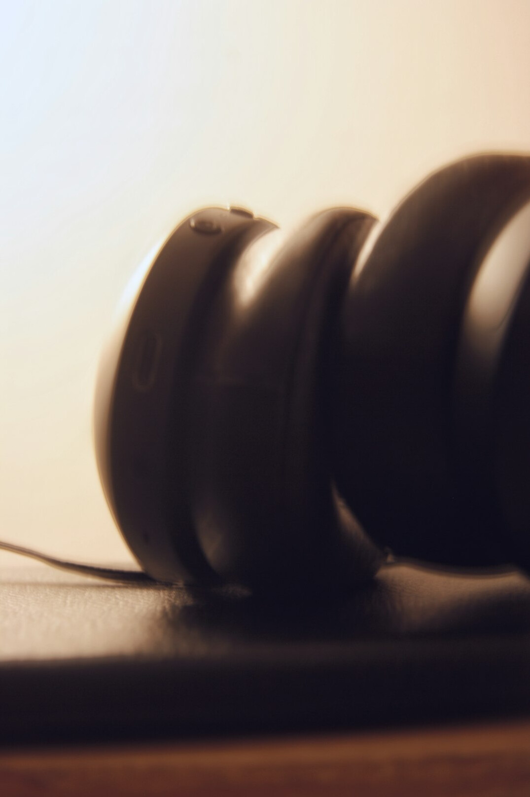 Two interview microphones facing each other on a table